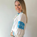 Split Neck Tasseled Embroidered Top